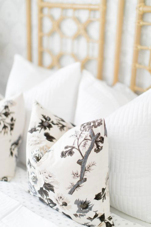 Pyne Hollyhock Charcoal Custom Designer Pillow on bed | Arianna Belle 