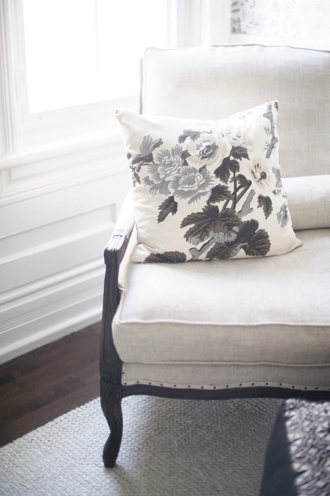 Pyne Hollyhock Charcoal Custom Designer Pillow on chair | Arianna Belle 