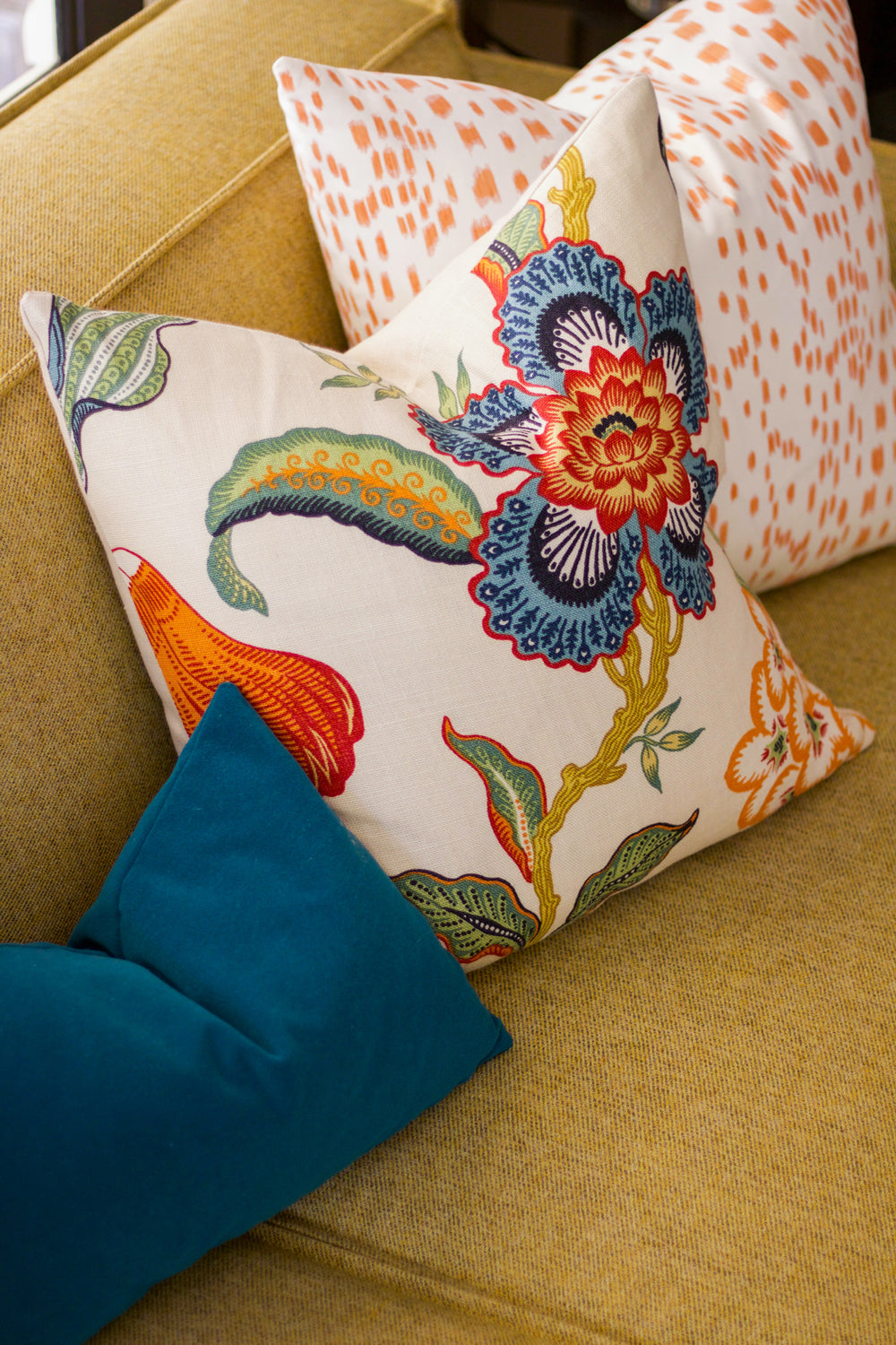 https://ariannabelle.com/cdn/shop/products/arianna-belle-designer-pillow-combination-on-sectional-sofa-peacock-velvet-hot-house-spark-les-touches-orange-home-of-natalie-steen.jpg?v=1699341217