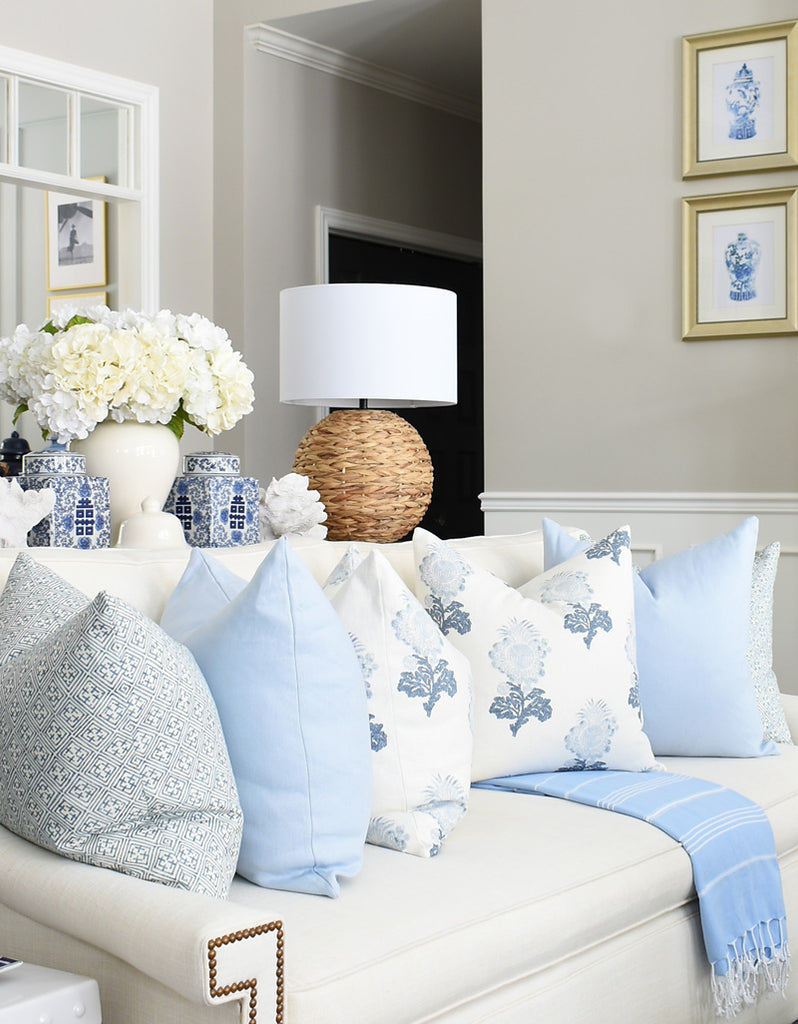 Blue and white Arianna Belle pillows on sofa: Adeline Blue, Chambray Linen, Lorna Blue | home of Tamara Anka