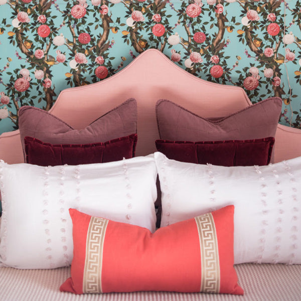 Coral with Greek Key Border Custom Designer Pillow on bed | Arianna Belle 